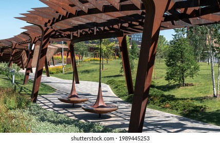 New public space in Moscow. Uniquel landscape park Tufel Grove with pergola and extensive green space.