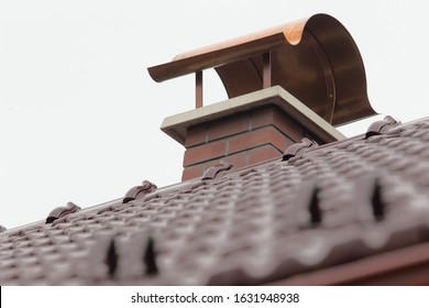 New red chimney on new roof with burgundy covering