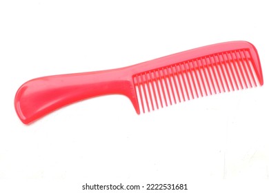 New Red Hair Comb Isolate On White Background. Women's Hair Comb, Red Accessories, Simple Comb For Girls Hair Care. Barber Salon Accessory. Hair Care Service Equipment. Coiffure Equipment