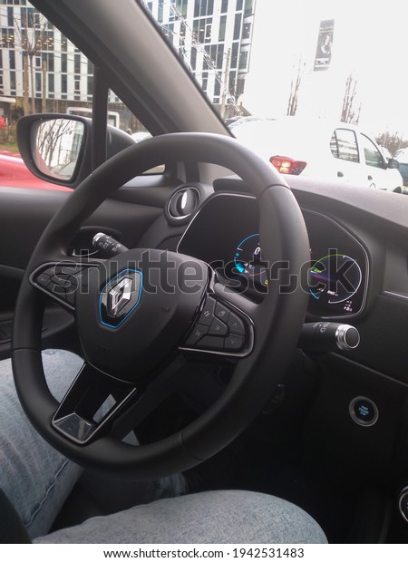 New Renault Zoe
electric car interior. Steering wheel with control buttons.
Bucharest, Romania, 2021