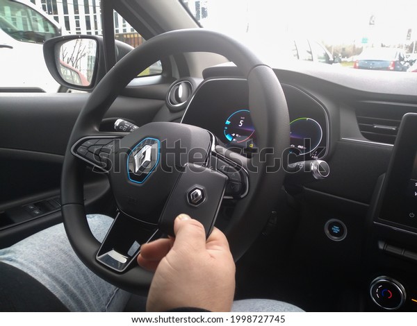 New Renault Zoe\
electric car interior. Steering wheel with control buttons.\
Bucharest, Romania, 2021