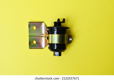 New Replacement Fuel Filter Diesel Engine Car And Truck Parts Isolated On Yellow Background.