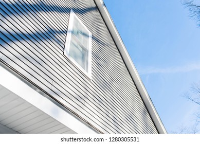 New Residential Home With Cream Vinyl Siding And New Window Installations