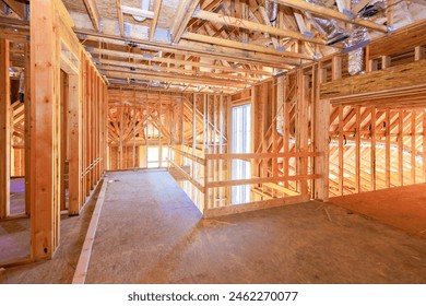 New residential under construction is framing an unfinished wood frame with wooden truss, post beam framework