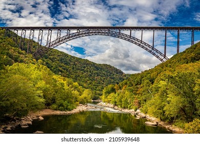 The New River Gorge Bridge at New River Gorge National Park and Preserve during the Autumn leaf color change near Fayetteville, West Virginia. - Shutterstock ID 2105939648