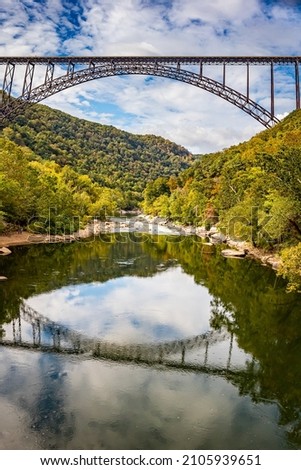 The New River Gorge Bridge at New River Gorge National Park and Preserve during the Autumn leaf color change near Fayetteville, West Virginia.