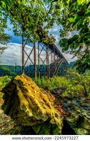 New River Gorge Bridge stretches from ridge to ridge 876' above the New River in Fayette County, West Virginia, USA