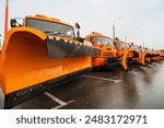 New road snow removal equipment is ready for winter. Snow plows, tractors, graders, excavators and cranes. Road equipment for snow removal and road repair