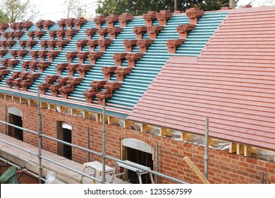 A New Roof Is Installed In The UK With Plain Red Clay Tiles