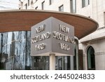 New Scotland Yard sign at the headquarters of the London Metropolitan police.