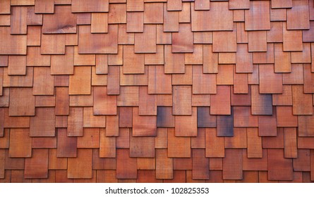 New section of a red shake cedar or redwood roof