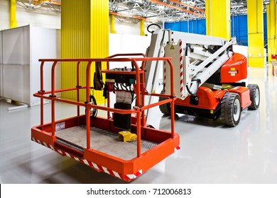 New self propelled lifting platform inside an empty assembly hall