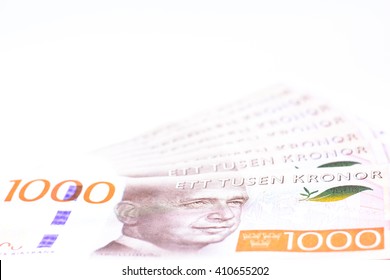 New Series Of One Thousand Swedish Currency,money Isolated On White Background,Focus On Eye Of A Man On Banknotes