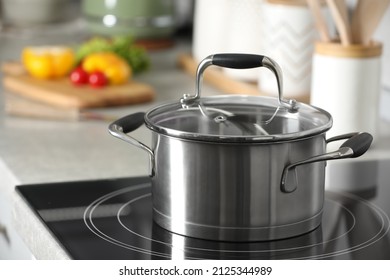New shiny pot with glass lid in kitchen - Shutterstock ID 2125344989