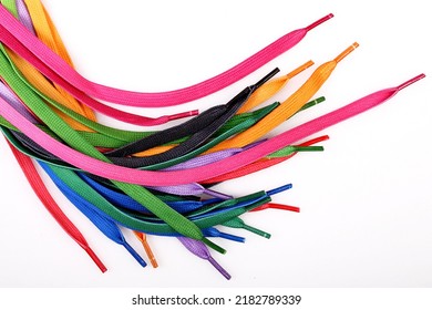 New shoelaces isolated on white background, colorful and bright, top view