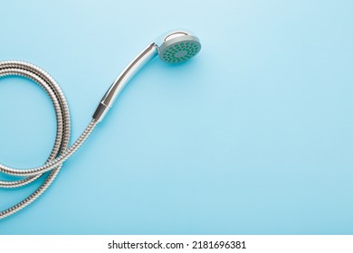 New shower head on light blue table background. Pastel color. Closeup. Washing concept. Empty place for text. - Shutterstock ID 2181696381