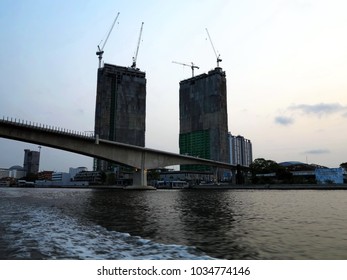 The new skyscraper buildings are constructing at the river bank. silhouette,background