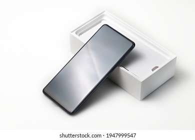 New smartphone with box isolated on white background.