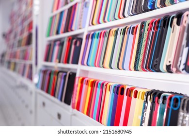 New Smartphones On Display Shelves In An Electronics Store