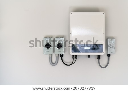 New solar panel inverter with isolators attached to the wall