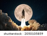 New space rocket with smoke and clouds takes off into the sky with full moon. Shuttle spaceship liftoff. Space Mission Launch Concept. 