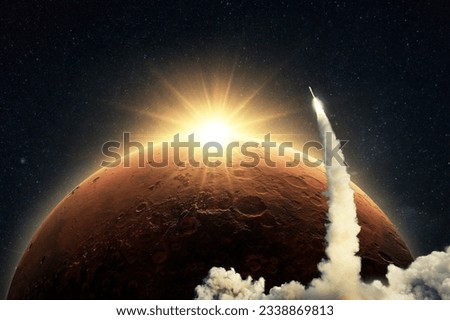 New space shuttle rocket with a blast and smoke takes off into space on background of the red planet Mars and sunrise light. Concept of technology and travel to Mars. Spaceship lift off 
