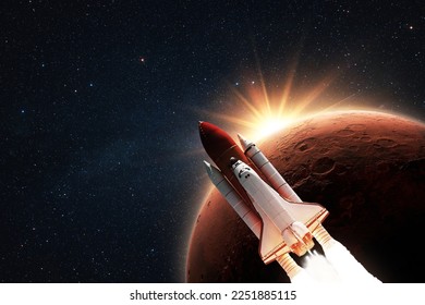 New space shuttle rocket successfully flies to the red planet Mars at sunset in starry space. Spacecraft launch and space mission to Mars at sunset - Powered by Shutterstock