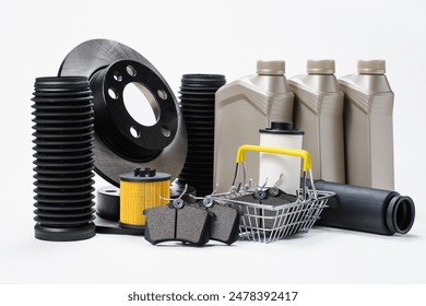 New spare parts for cars and shopping cart on a white background. Transport service concept and online sale of spare parts - Powered by Shutterstock