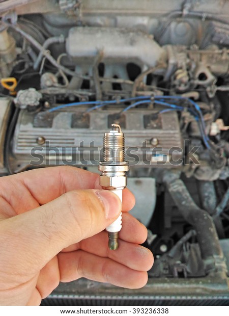 A new spark plug in
hand
