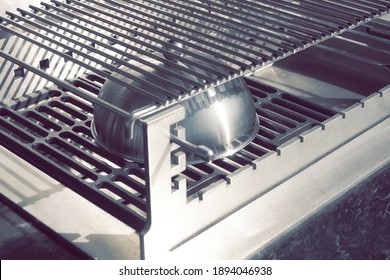 New Stainless Steel BBQ Grill On Backyard Outdoor Kitchen, Isolated. Luxury Clean Barbeque Grill Appliance With Marbled Tabletop. Outdoor BBQ Charcoal Grill Isolated On White  Background