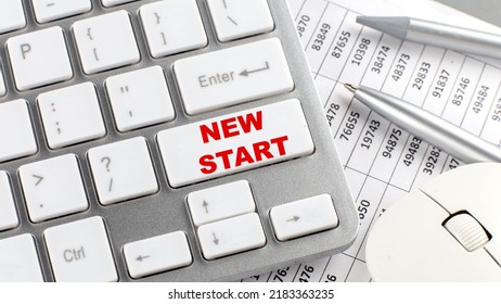 NEW START Text On A Keyboard Wirh Chart And Pencil