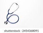 New stethoscope on white background, top view. Medical instrument