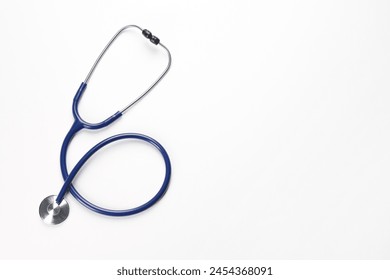 New stethoscope on white background, top view. Medical instrument