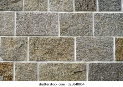 New stone cladding plates on the wall closeup 