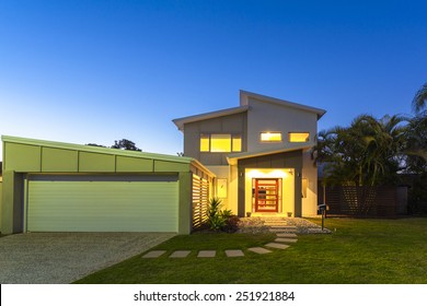 New Stylish Modern Home Exterior At Dusk