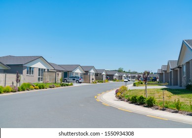 New Subdivision Street With Uniform Homes.