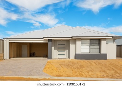 new suburban house in the final stages of construction against cloudy sky - Shutterstock ID 1108150172