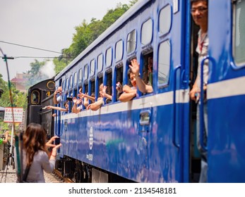 New Taipei City, SEP 4 2011 - Sunny View Of A Fu-Hsing Semi Express Train With Many People Waving Their Hands