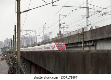 New Taipei City , Taiwan - January 5th ,2018 : Taroko Express Train Is Driving On Railway On The Bridge