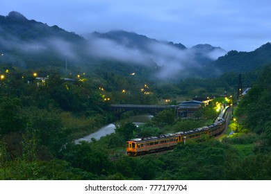 New Taipei City Taiwan's summer, foggy valleys, rustic rural dusk lights, open light trains Panoramic pictures of farmland driving through. - Powered by Shutterstock