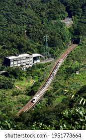 New Taipei, Taiwan-2／22／2021: Overlooking The Taroko Express Train Rushing Out Of The Tunnel.