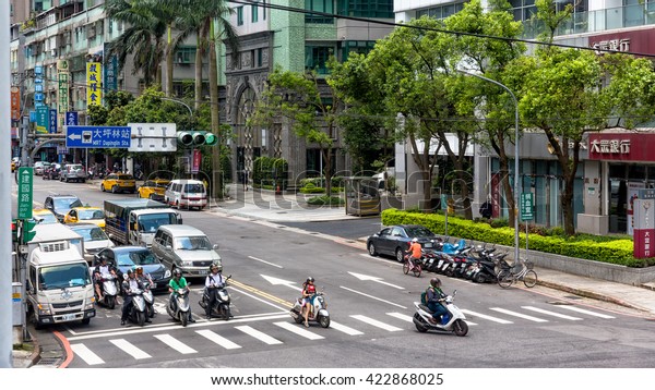 New\
Taipei Taiwan - MAY 03 2016 : Cars, buses on street at Minquan\
Road, Street view in Minquan Road, New Taipei,\
Taiwan
