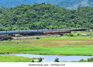 New Taipei, Taiwan - 8／3／2022: A Taiwan Railway Steam Locomotive Pulls A Test Run Train Through The Wetlands.