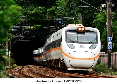 New Taipei, Taiwan-6／7／2021: A Taiwan Railway Taroko Express Train Rushes Out Of The Tunnel.