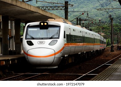 New Taipei, Taiwan-4／26／2021: A TEMU1000 Taroko Express Train Passes Through Fulong Station.