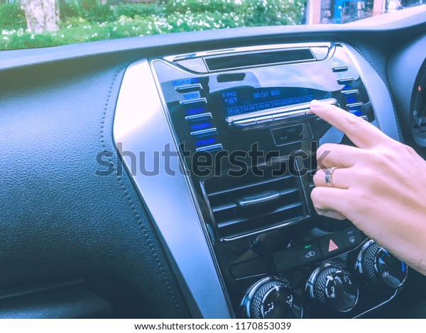 new technology and transportation concept from\
interior and display control in car with human hand touch on screen\
and use application system