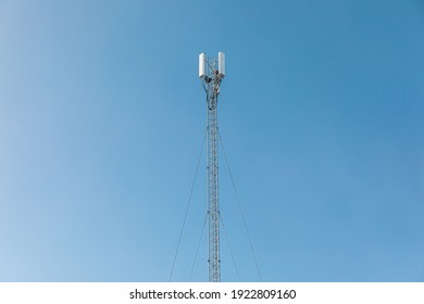 New Telecommunication Antenna On Background Of Blue Sky. Satellite Dish Telecom Network At Communication Technology Network. Telecom Broadcasting Tower. Modern Cell Tower 5G, 6G