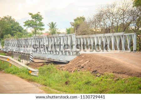 New temporary steel bridge is replace the reinforce concrete bridge during flood damage at the highway. Imagine de stoc © 
