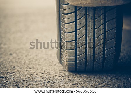 New tire full of tire tread / Checking tire depth for road safety concept