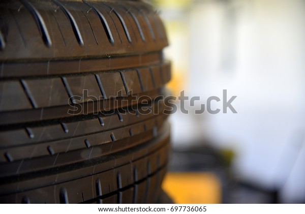 new tire at shop for car\
service 